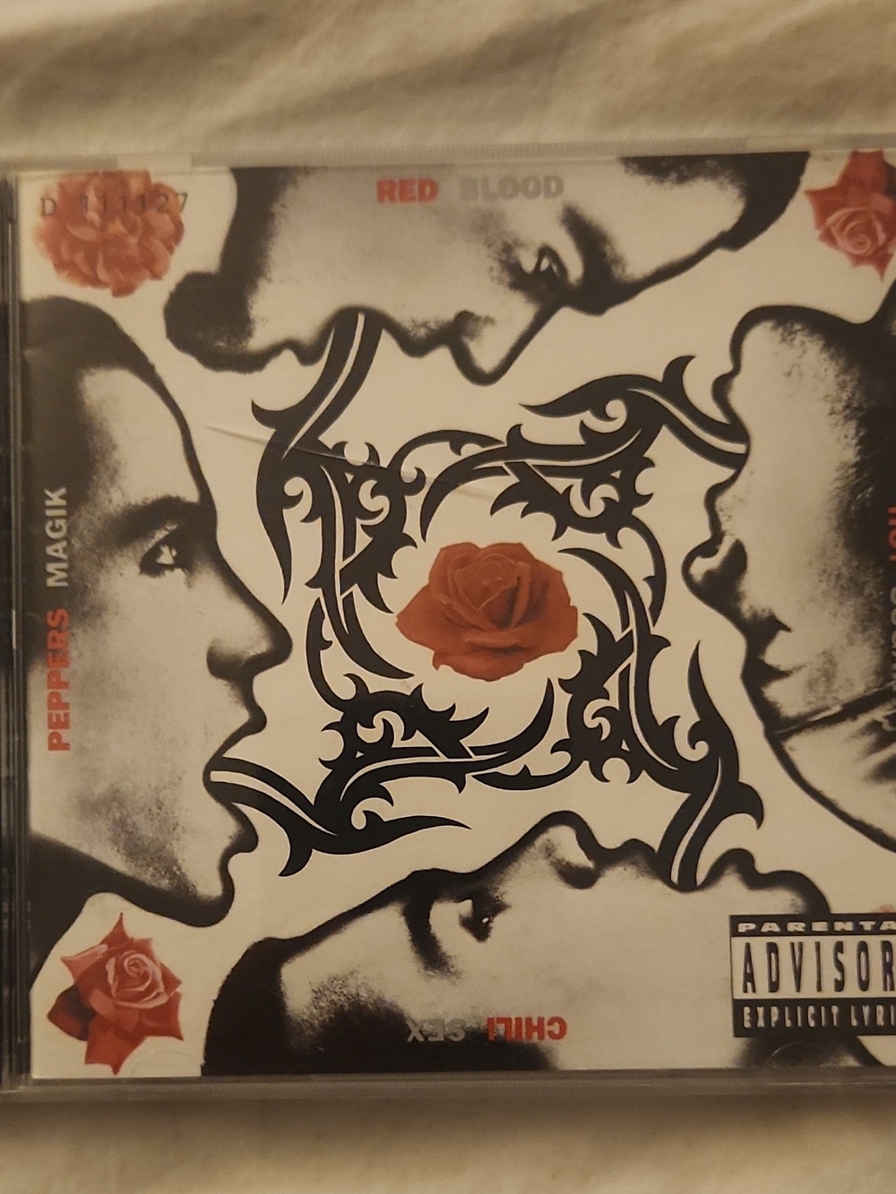 Warner Bros. CD Jewel Case with Black Ornamental Artwork and Red Roses